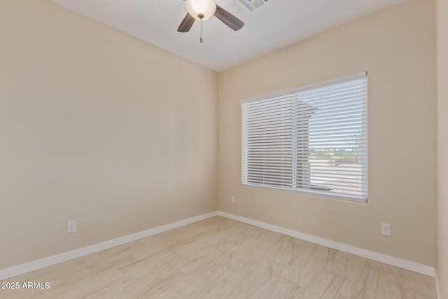 14646 S Brook Hollow Rd, Arizona City, AZ 85123 - empty room featuring baseboards, marble finish floor, visible vents, and ceiling fan