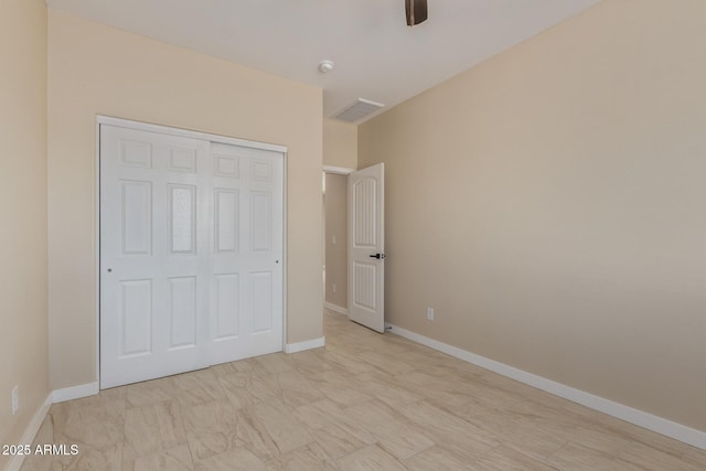 14646 S Brook Hollow Rd, Arizona City, AZ 85123 - unfurnished bedroom with a closet, visible vents, baseboards, and a ceiling fan