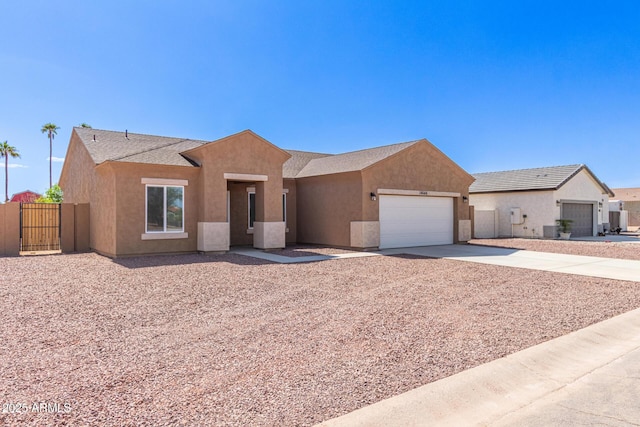 14646 S Brook Hollow Rd, Arizona City, AZ 85123 - single story home with driveway, fence, an attached garage, stucco siding, and a gate