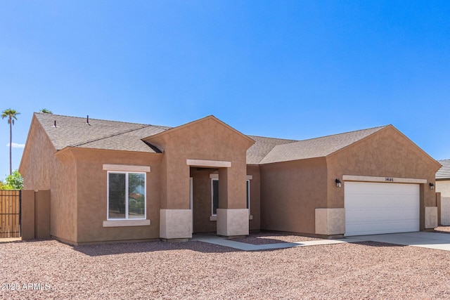 14646 S Brook Hollow Rd, Arizona City, AZ 85123 - view of front facade with concrete driveway, an attached garage, stucco siding, and fence