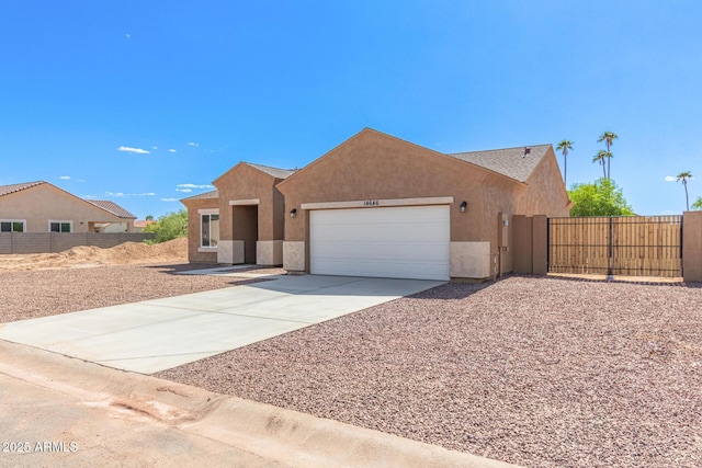 14646 S Brook Hollow Rd, Arizona City, AZ 85123 - ranch-style house featuring a gate, fence, driveway, a garage, and stucco siding
