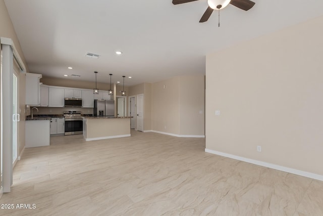 14646 S Brook Hollow Rd, Arizona City, AZ 85123 - unfurnished living room featuring a ceiling fan, a sink, visible vents, baseboards, and recessed lighting