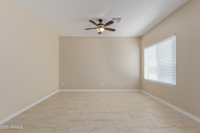 14646 S Brook Hollow Rd, Arizona City, AZ 85123 - unfurnished room featuring baseboards, visible vents, marble finish floor, and a ceiling fan