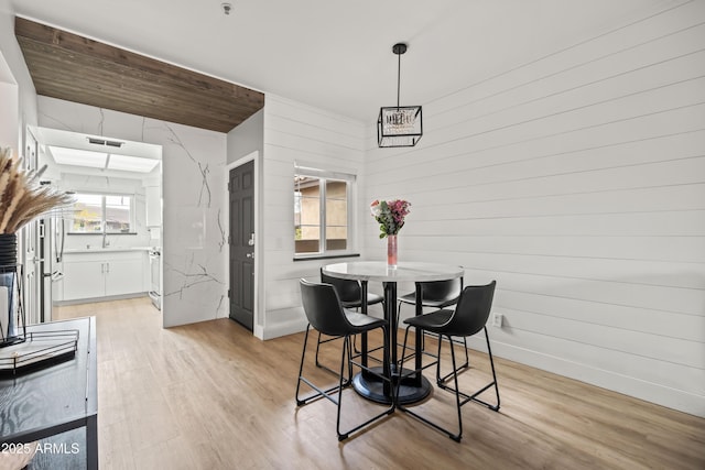 dining space featuring light hardwood / wood-style flooring