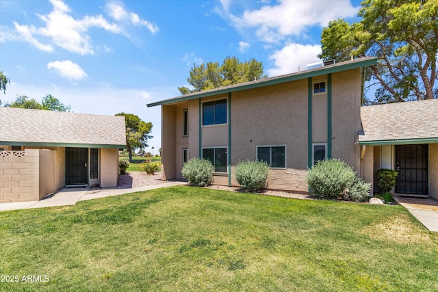 18206 N 45th Ave, Glendale, AZ 85308 - rear view of house featuring a lawn and stucco siding