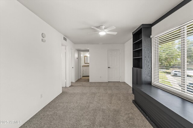 18206 N 45th Ave, Glendale, AZ 85308 - unfurnished room featuring ceiling fan, light colored carpet, healthy amount of natural light, and baseboards