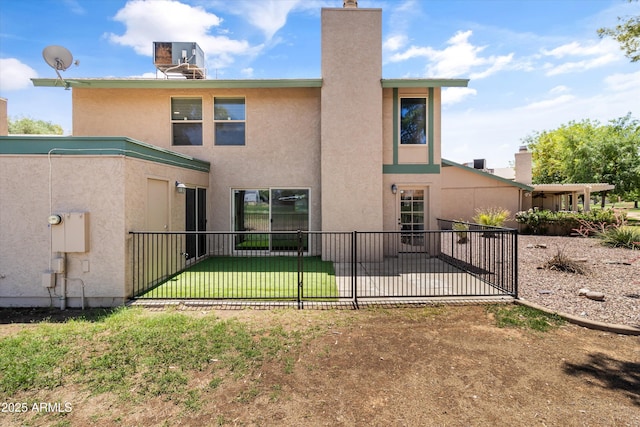 18206 N 45th Ave, Glendale, AZ 85308 - back of property featuring stucco siding, a patio area, and a chimney
