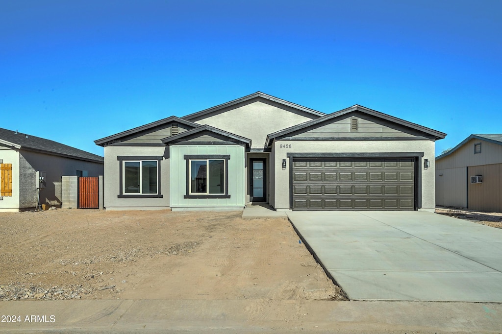 ranch-style home with a garage