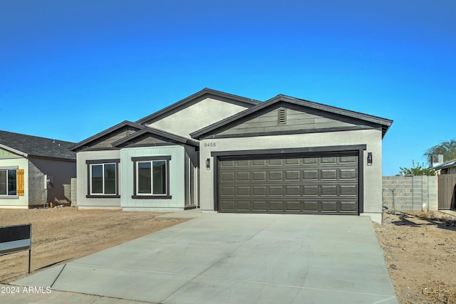 ranch-style home featuring a garage