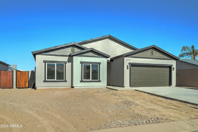 single story home featuring a garage