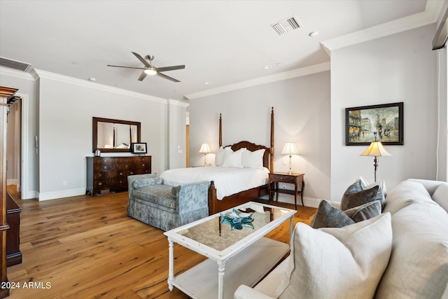 bedroom with wood-type flooring, visible vents, and baseboards