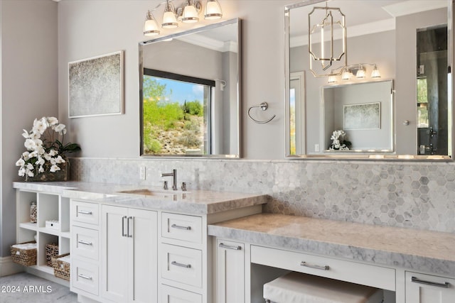 bathroom with crown molding, backsplash, and vanity