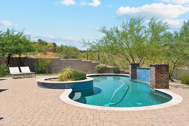 view of swimming pool featuring a fenced in pool, a fenced backyard, and a patio