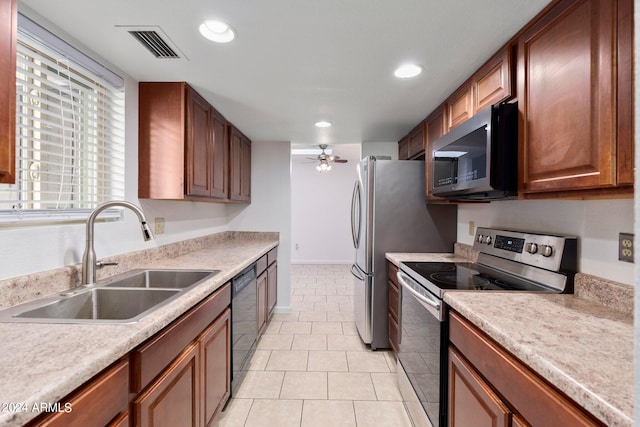 kitchen with ceiling fan, light tile patterned floors, stainless steel appliances, and sink