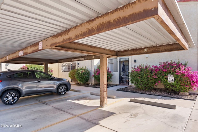 view of parking / parking lot with a carport