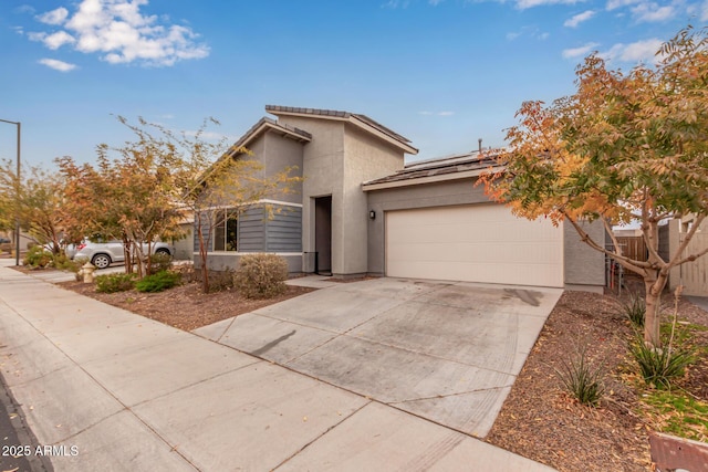 view of front of home featuring a garage and solar panels