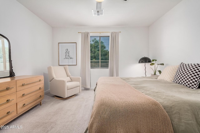 bedroom featuring light colored carpet and ceiling fan