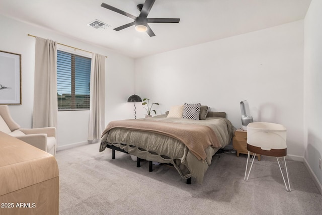 bedroom featuring light carpet, baseboards, and a ceiling fan