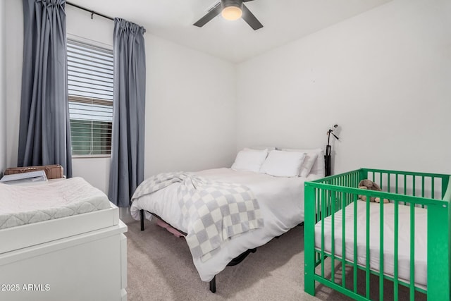 carpeted bedroom with a ceiling fan