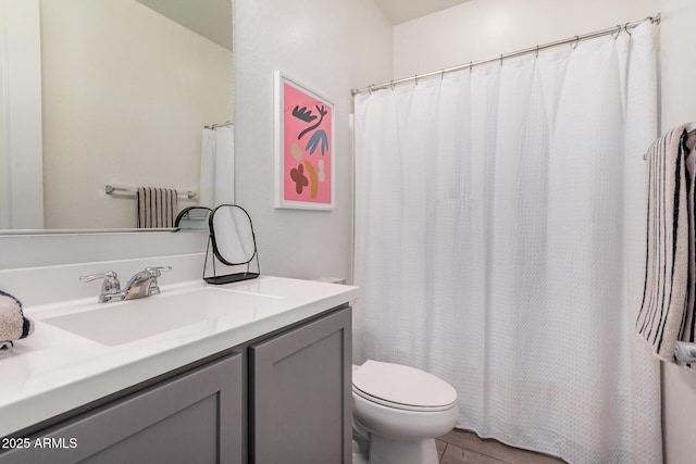 bathroom featuring vanity, toilet, wood finished floors, and a shower with curtain