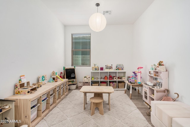 game room featuring light wood-style floors