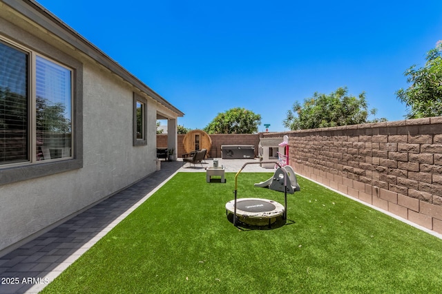 view of yard with a patio area and a fire pit