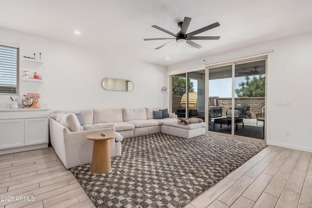 living area featuring light wood-style floors, ceiling fan, and recessed lighting