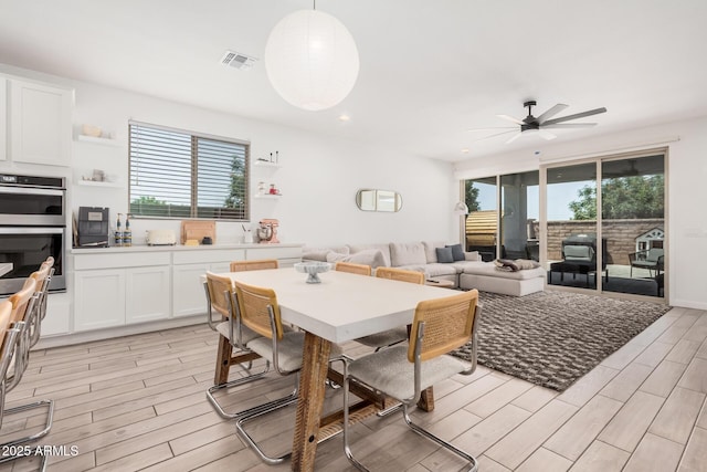 dining area with ceiling fan, light wood-type flooring, and recessed lighting