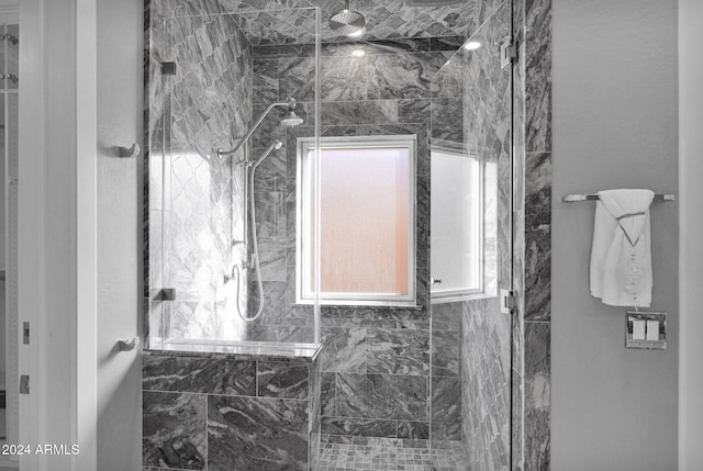 bathroom with a tile shower