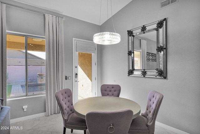 dining space with a notable chandelier