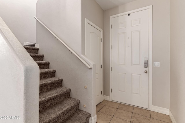 foyer entrance featuring light tile patterned flooring