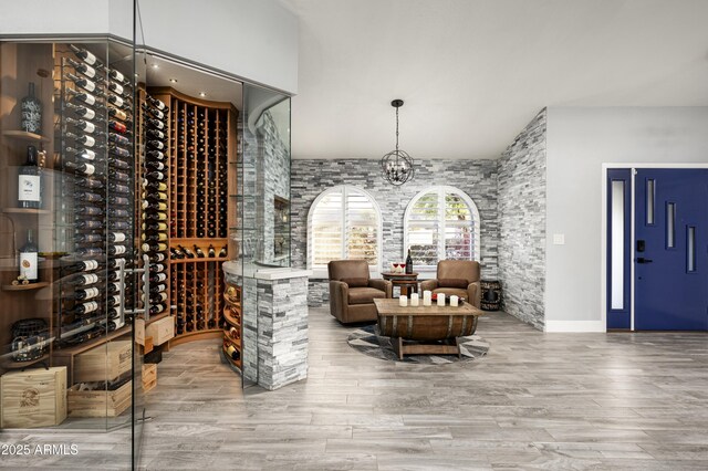 6102 E Nisbet Rd, Scottsdale, AZ 85254 - wine room with hardwood / wood-style flooring and an inviting chandelier