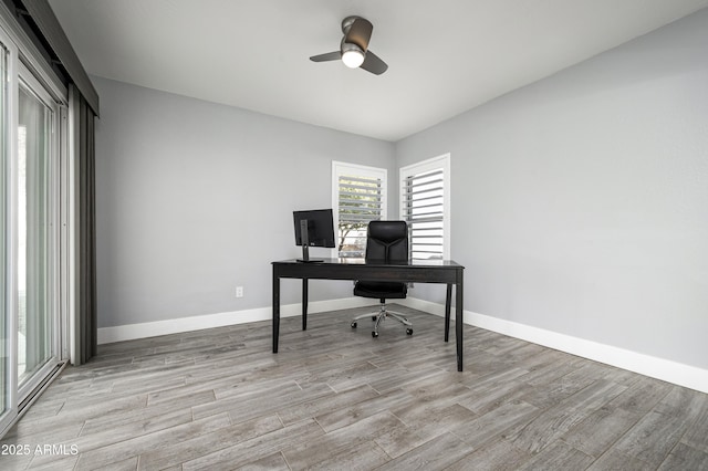 6102 E Nisbet Rd, Scottsdale, AZ 85254 - home office with light hardwood / wood-style floors and ceiling fan