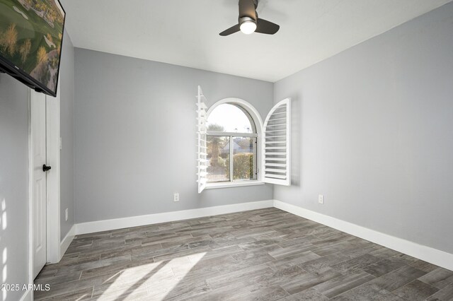 6102 E Nisbet Rd, Scottsdale, AZ 85254 - spare room with hardwood / wood-style floors and ceiling fan