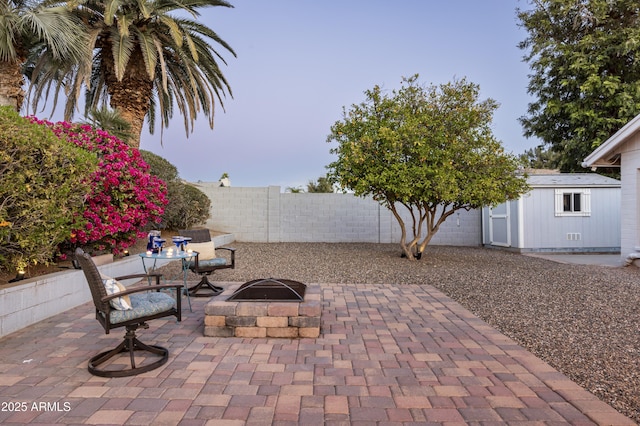 6102 E Nisbet Rd, Scottsdale, AZ 85254 - view of patio with a storage shed and an outdoor fire pit