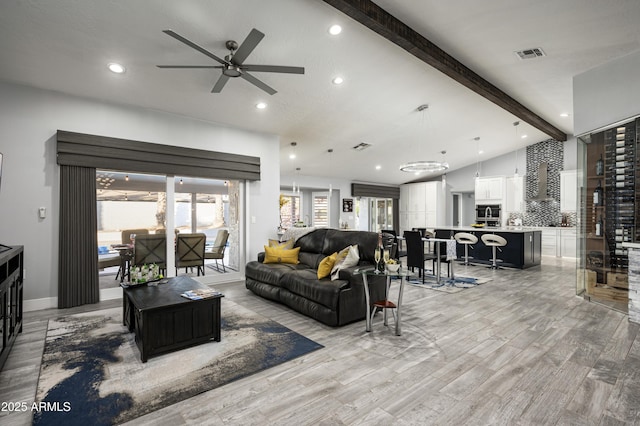 6102 E Nisbet Rd, Scottsdale, AZ 85254 - living room featuring lofted ceiling with beams, light hardwood / wood-style floors, and ceiling fan