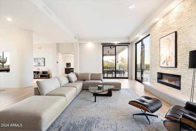 living room featuring a fireplace and light hardwood / wood-style floors