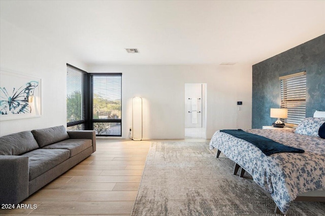 bedroom with light wood-type flooring