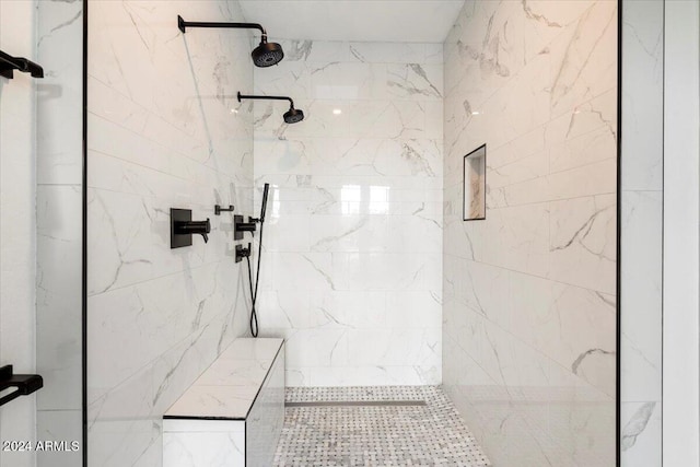 bathroom with a tile shower