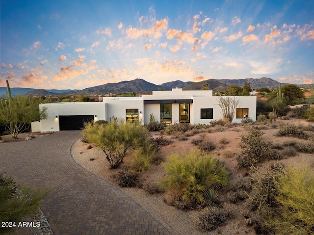 pueblo revival-style home featuring a mountain view