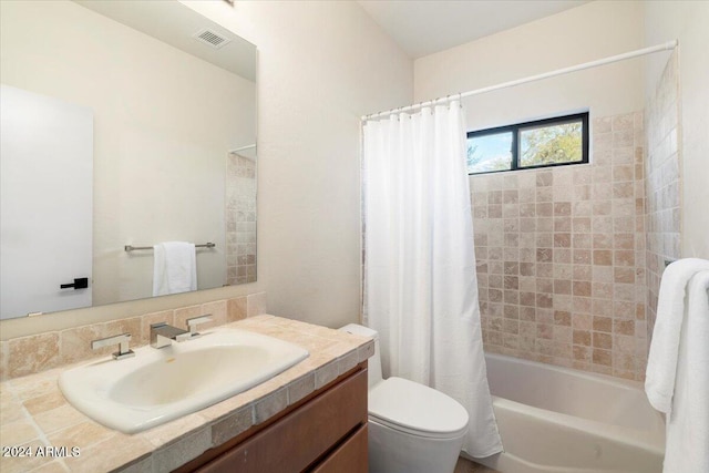 full bathroom featuring vanity, toilet, shower / bath combination with curtain, and tasteful backsplash