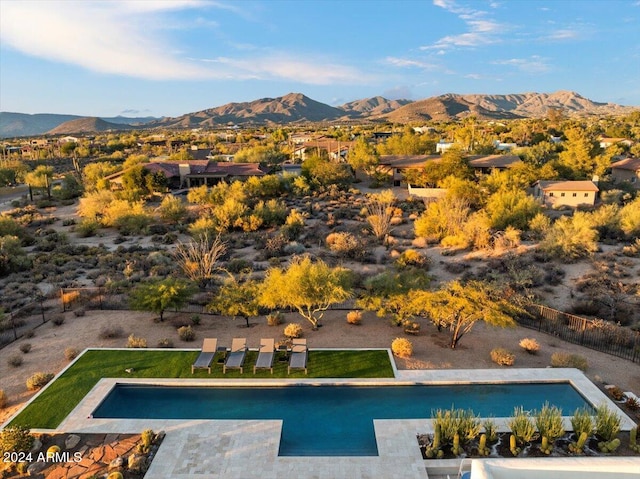 view of pool featuring a mountain view and a patio area