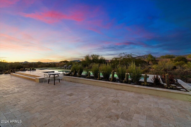 exterior space featuring a patio and a mountain view