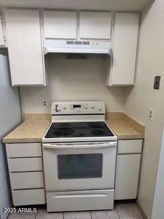 kitchen with white cabinets, white electric range, under cabinet range hood, and light countertops