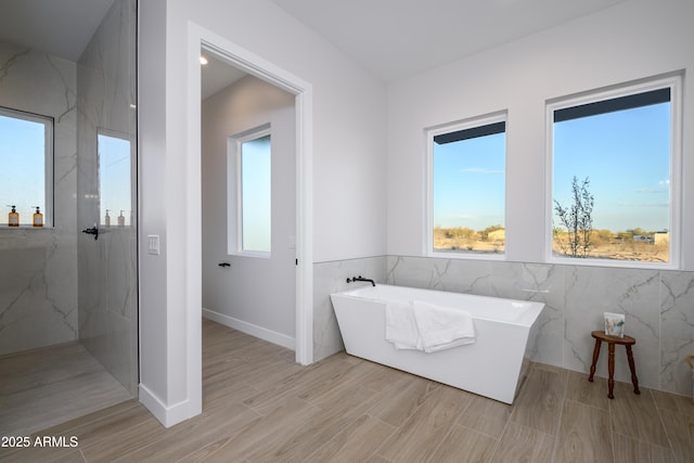 bathroom featuring a washtub