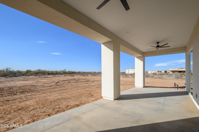 view of patio / terrace featuring ceiling fan