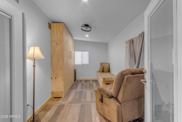 sitting room featuring light hardwood / wood-style flooring