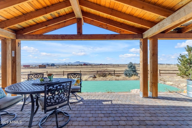 view of patio / terrace featuring a gazebo, a rural view, and a mountain view