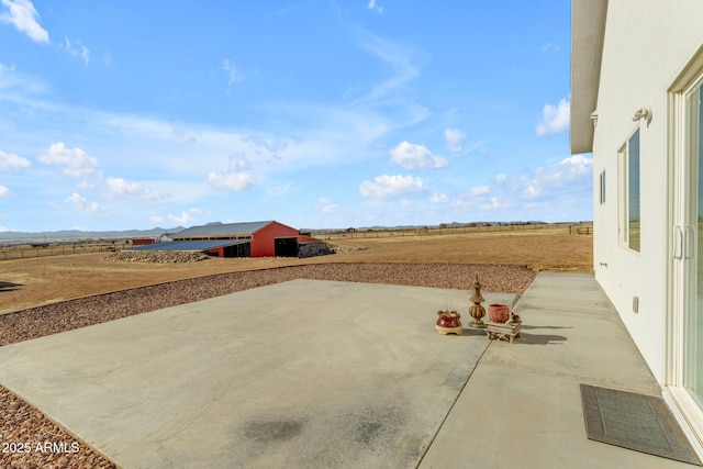 view of patio with a rural view