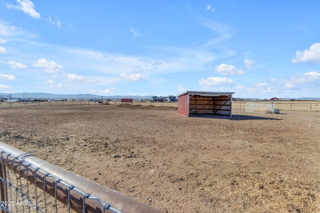 view of yard with a rural view